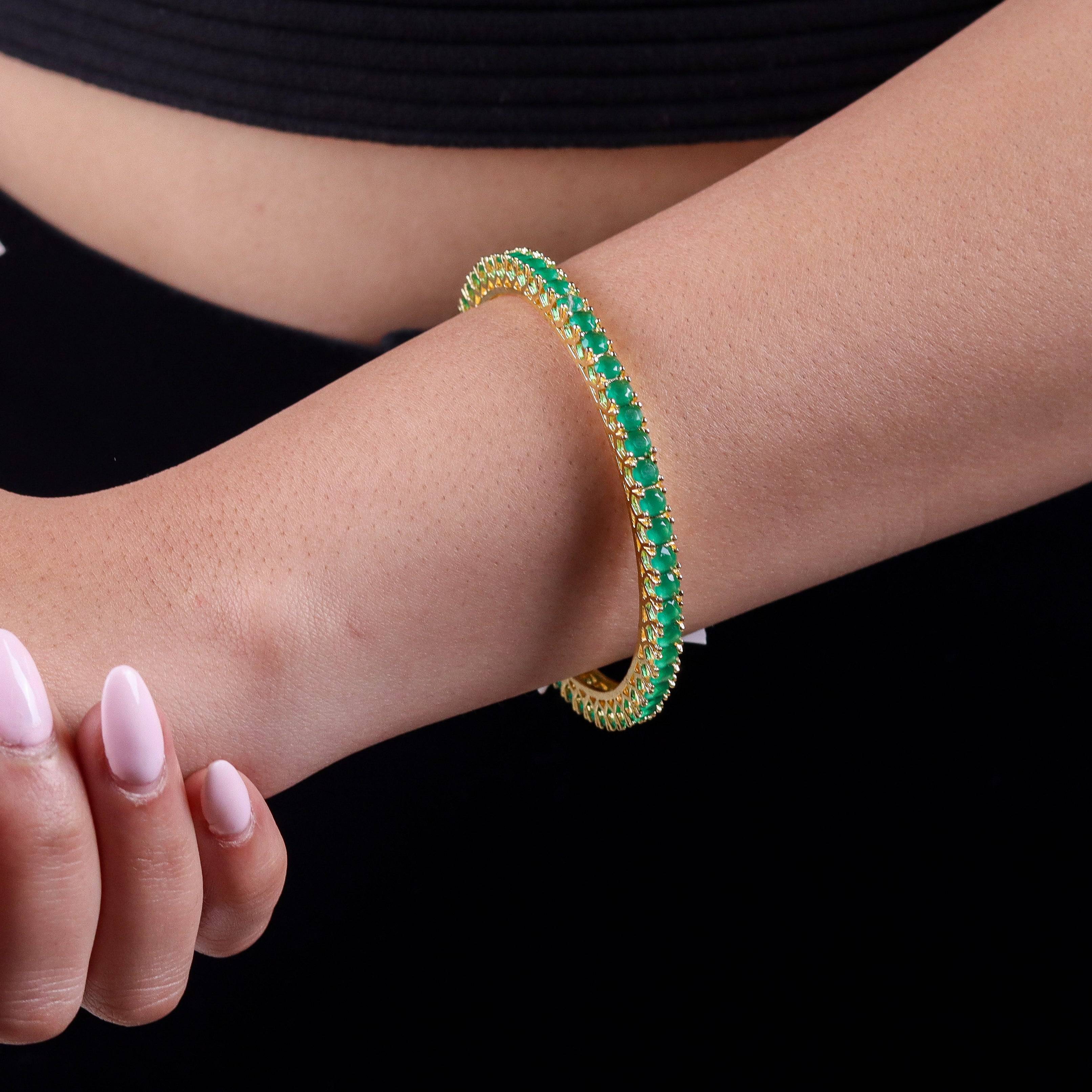 Model wearing a 22K gold-plated fashion bangle (single) for a sophisticated and elegant jewelry look