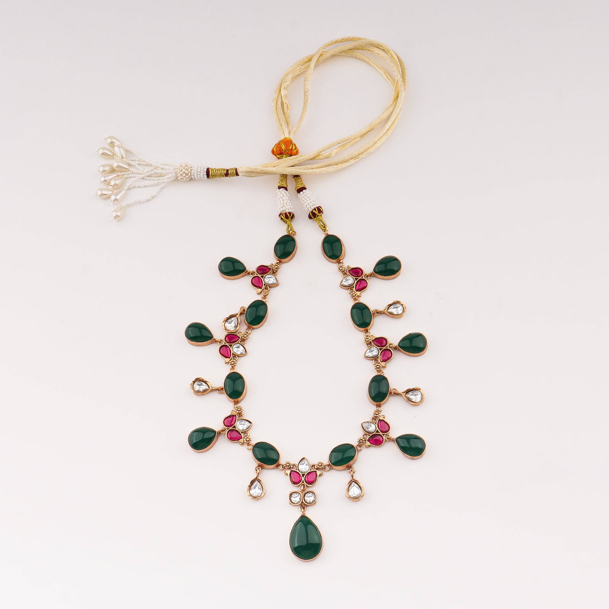 Detailed view of 22K gold-plated fashion set highlighting intricate motifs, textured detailing, and premium 22K gold-plated finish