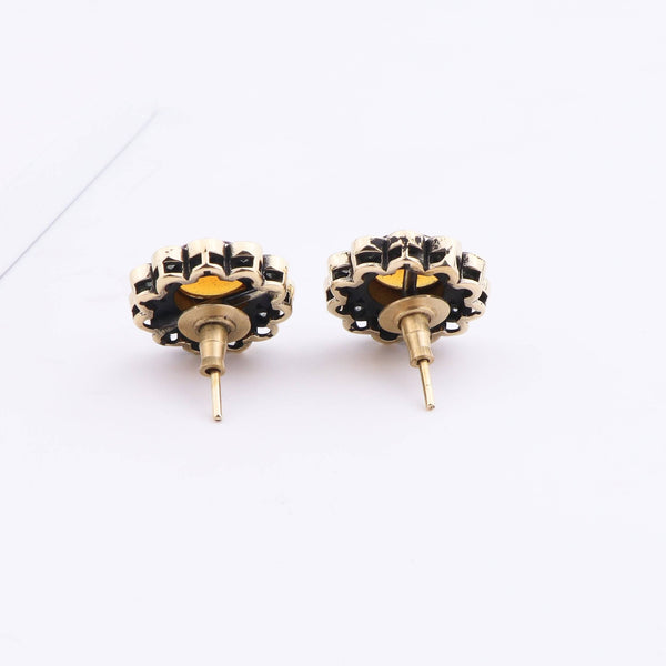 Detailed view of Brass Fashion Earrings highlighting intricate motifs, textured surface, and refined brass finish