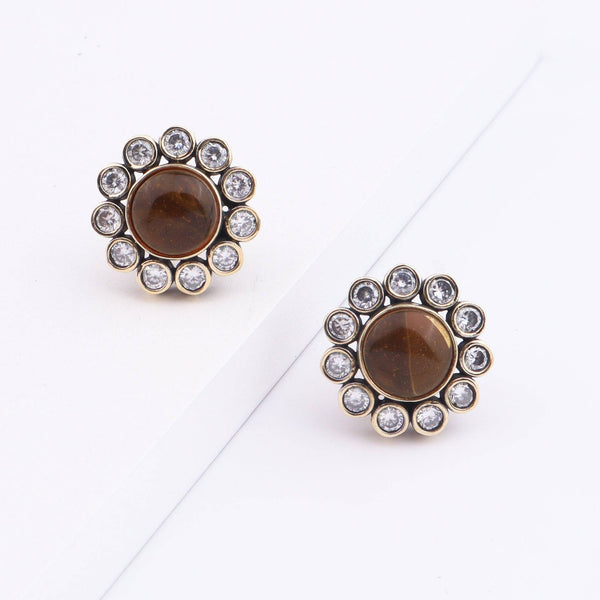 Angled view of Brass Fashion Earrings highlighting the unique silhouette, structure, and polished brass finish