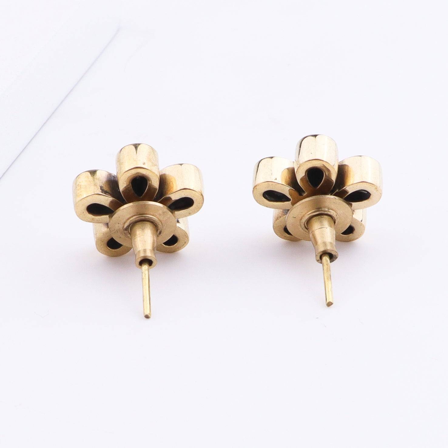 Angled view of Brass Fashion Earrings highlighting the unique silhouette, structure, and polished brass finish