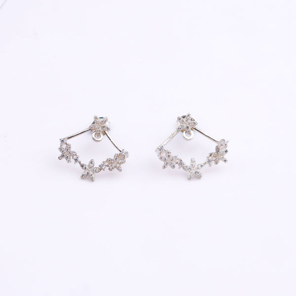 Silver flower vine CZ jacket earrings with cubic zirconia on white background