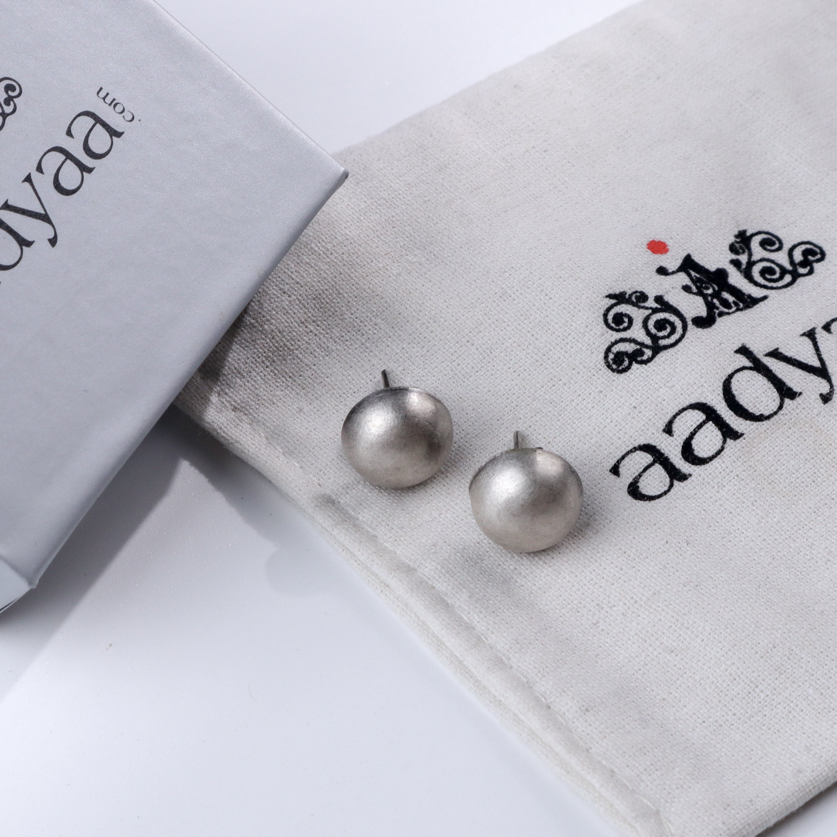 Small Dome Silver Earrings on Aadyaa jewelry pouch