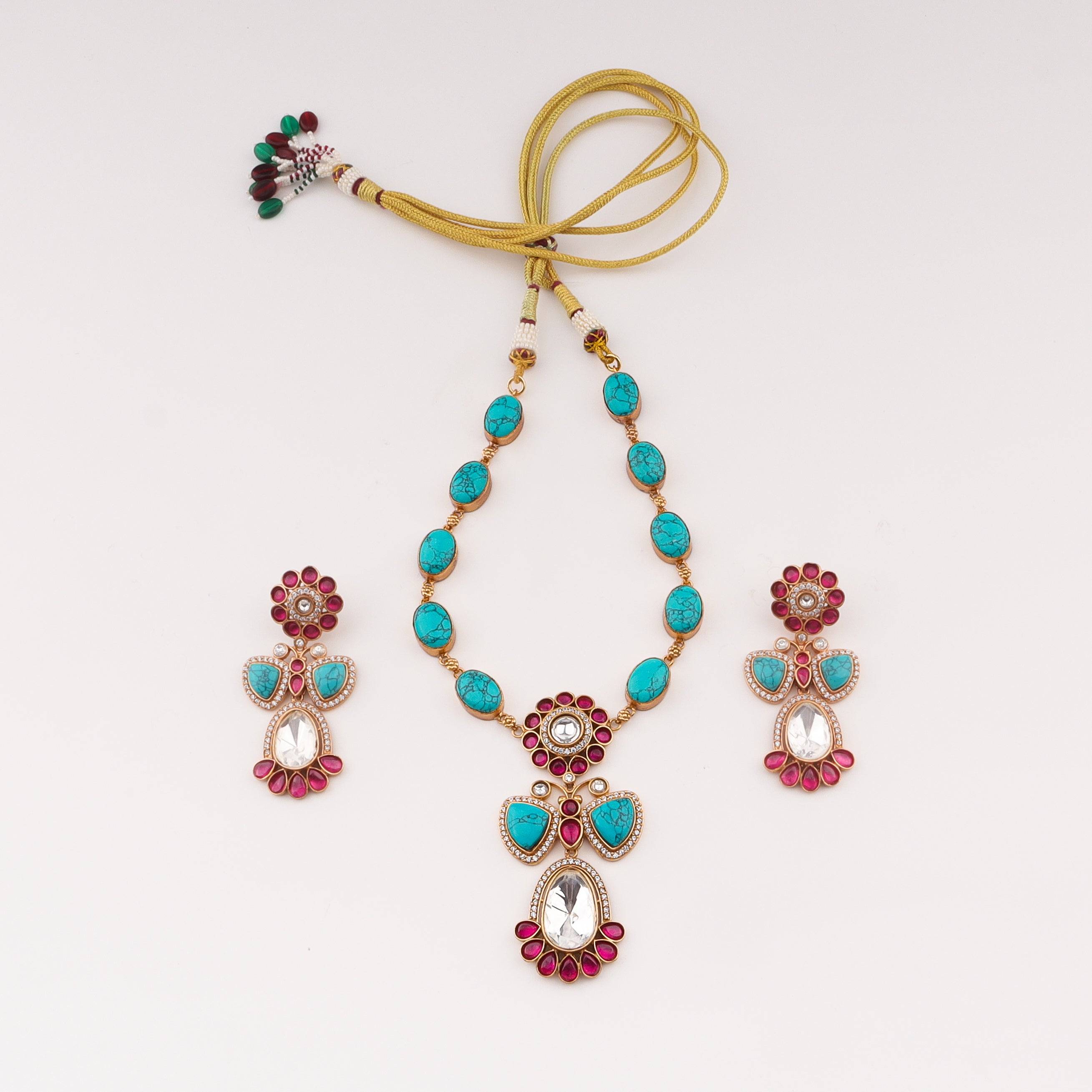 Detailed view of a 22K gold-plated fashion set highlighting intricate motifs, textured detailing, and a premium 22K gold-plated finish