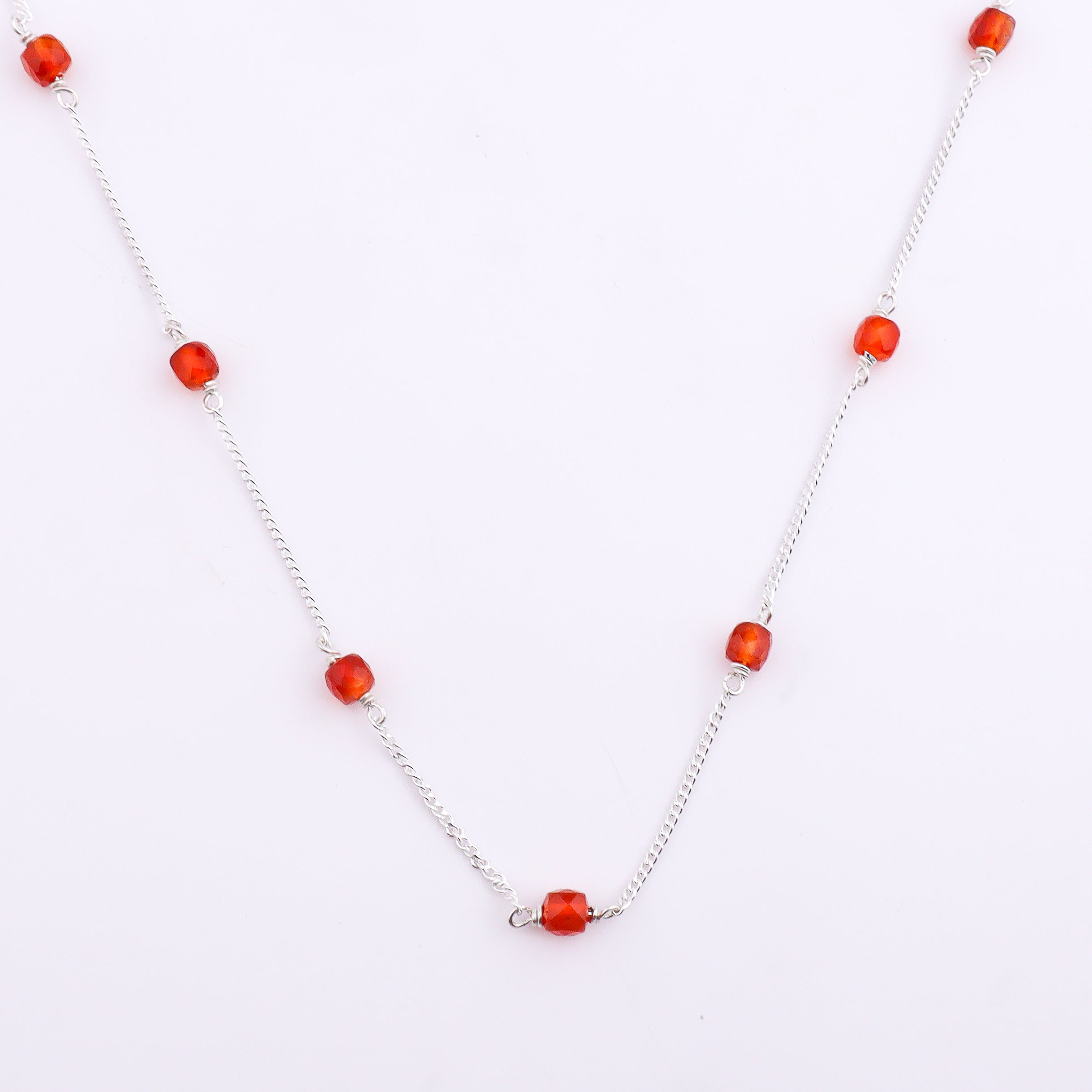 Silver chain with orange beads