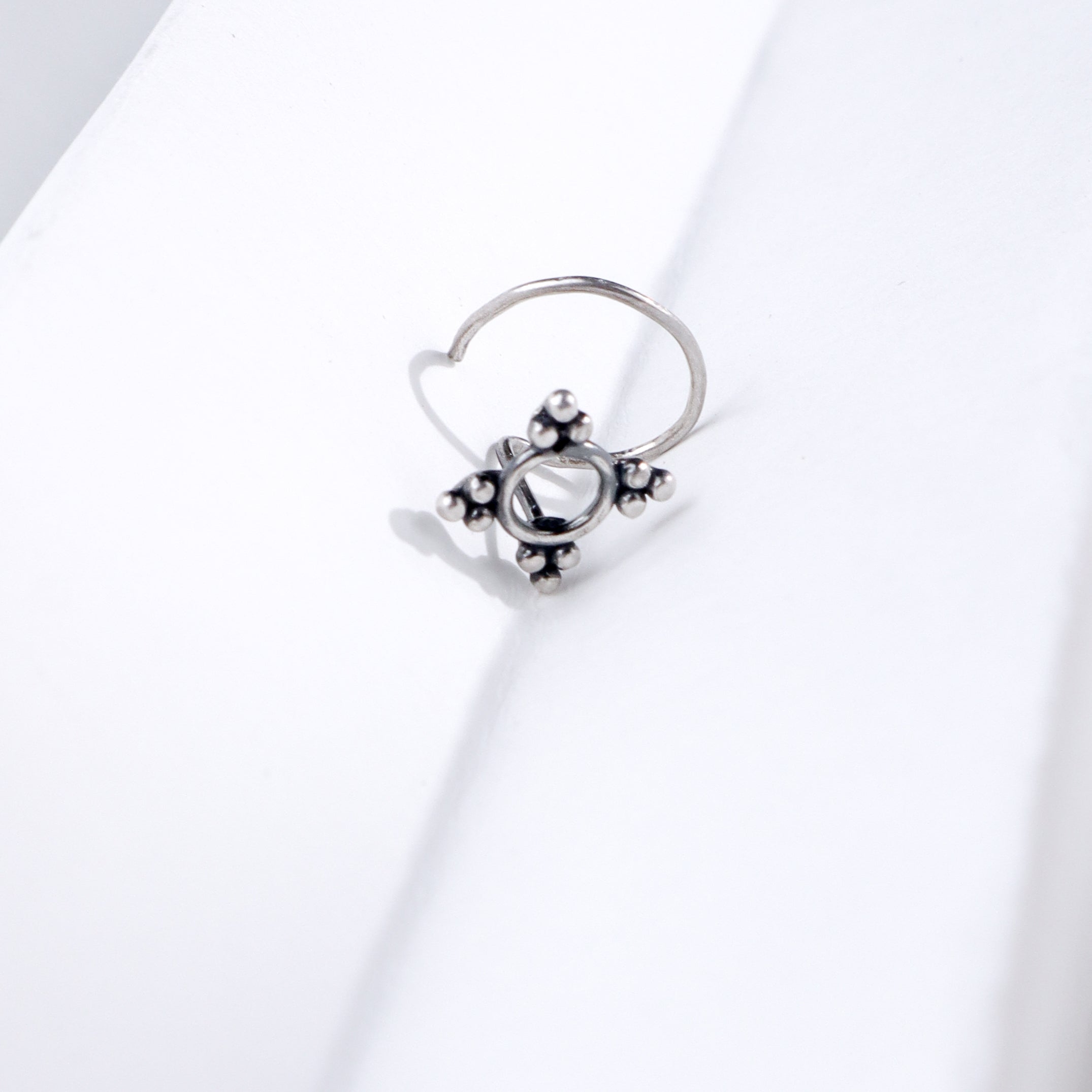 Minimal silver nose pin with floral design for everyday elegance