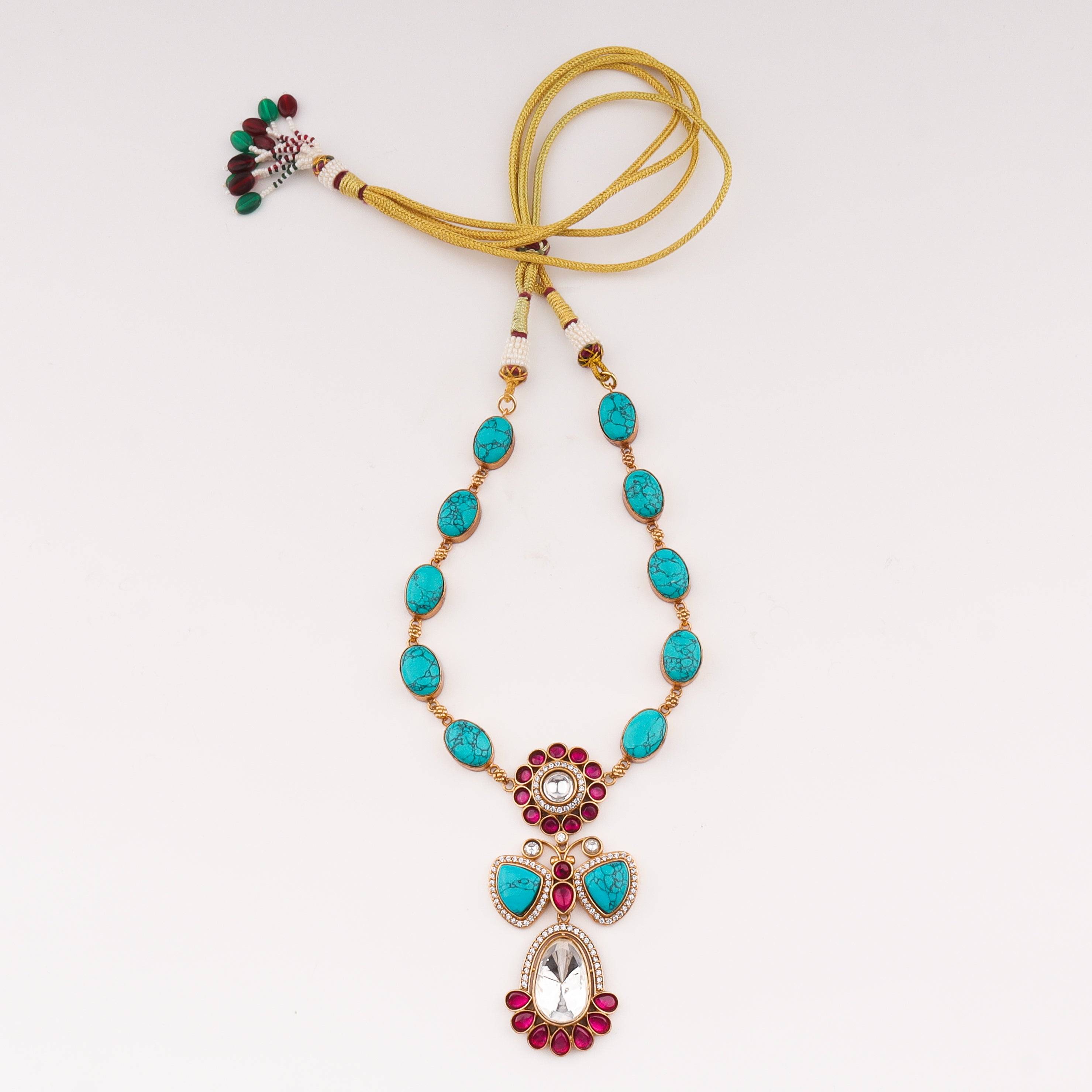 Detailed view of a 22K gold-plated fashion set highlighting intricate motifs, textured detailing, and premium 22K gold-plated finish