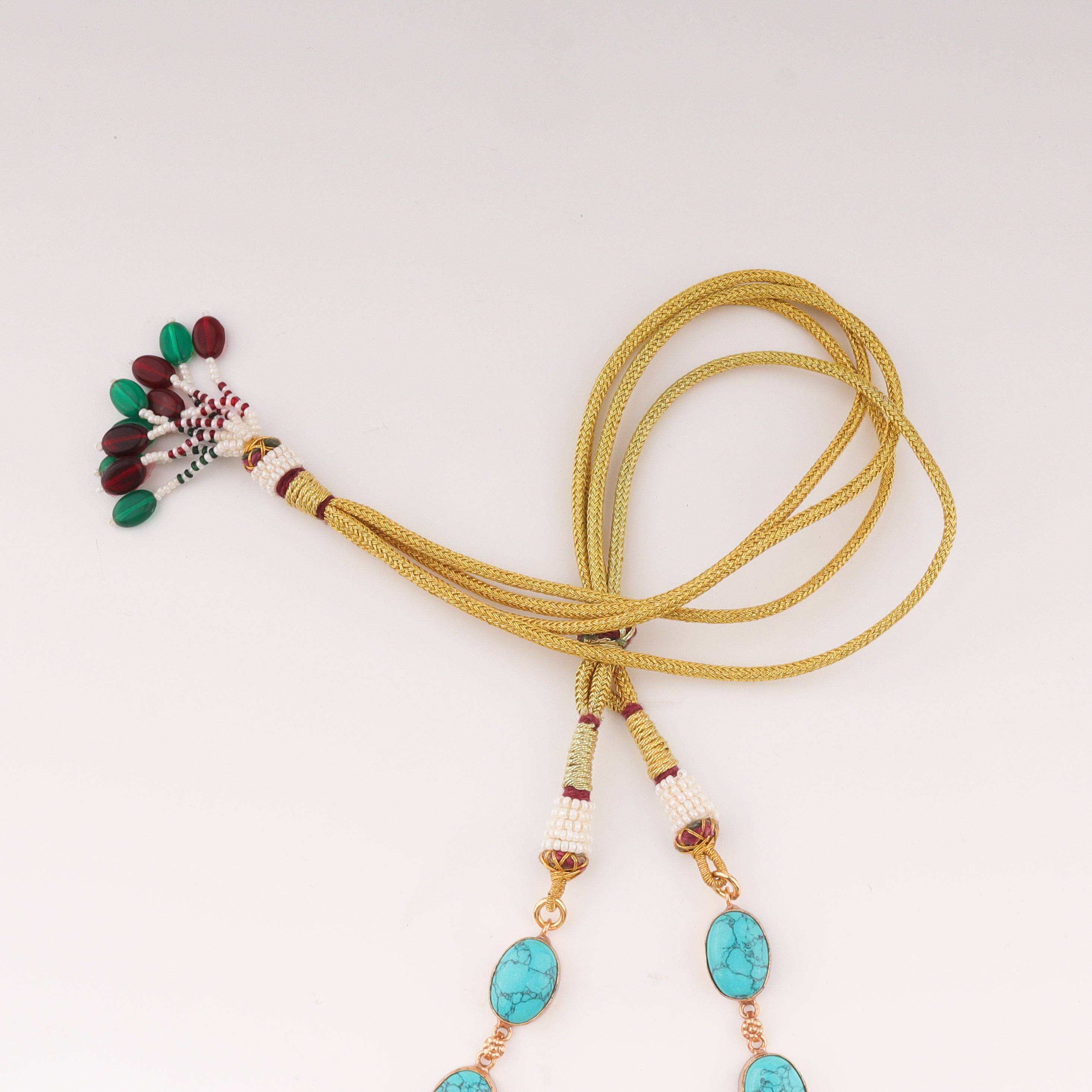 Angled view of a 22K gold-plated fashion set highlighting its coordinated design, elegant structure, and polished gold finish