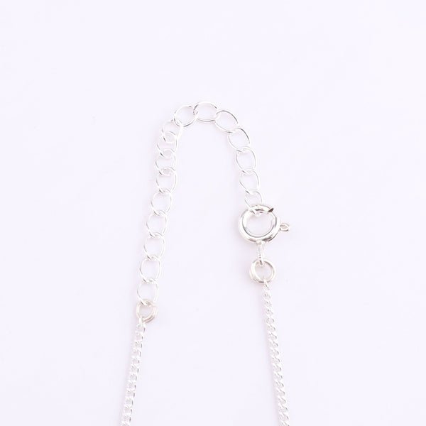 Silver chain with turquoise bead and clasp detail