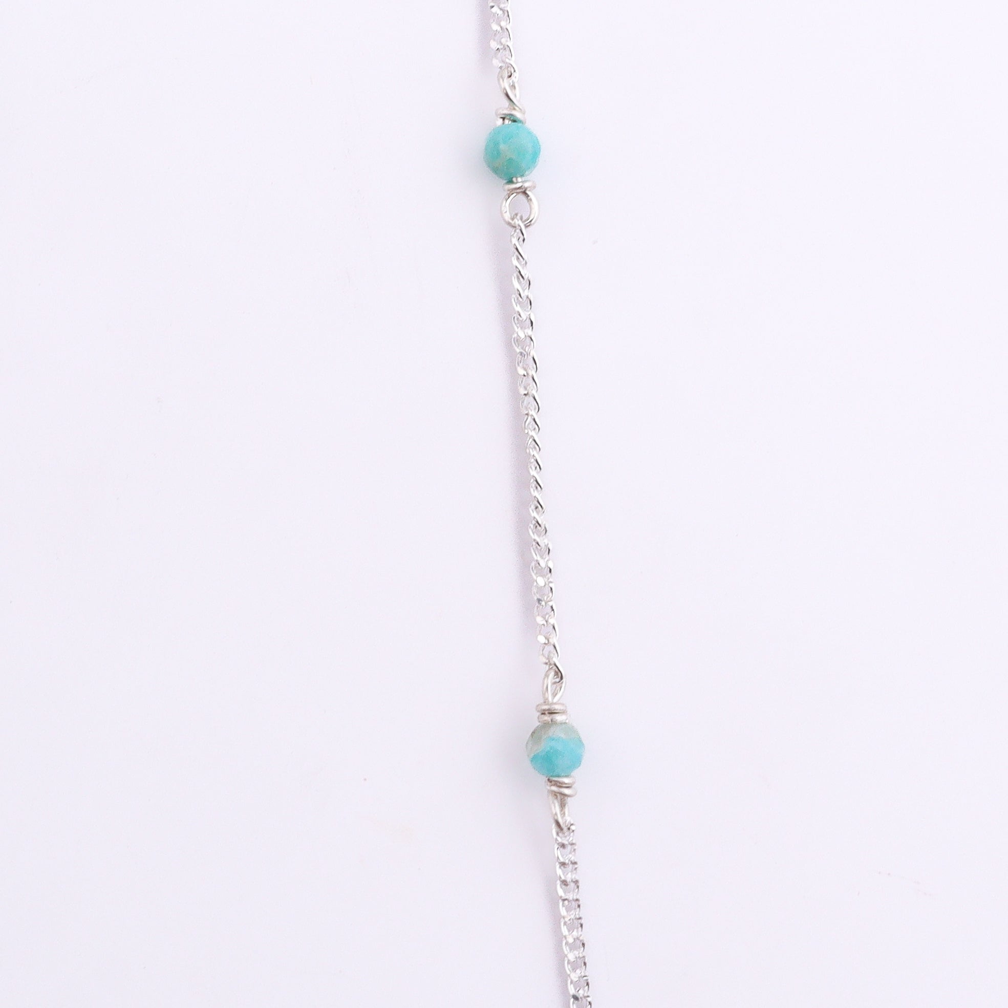 Silver chain with blue jade bead and clasp detail