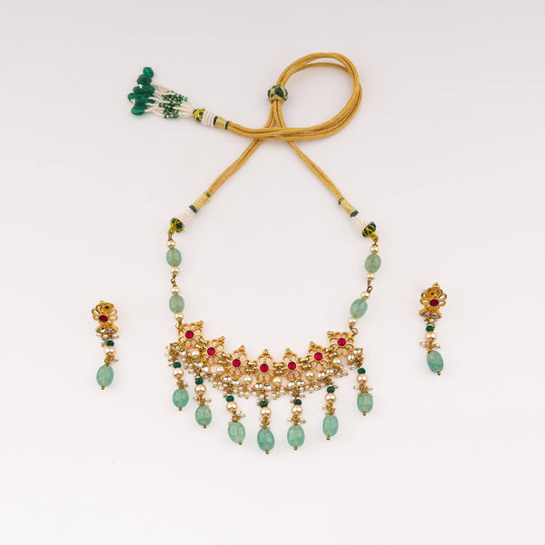 Detailed view of the 22K gold-plated fashion set highlighting intricate motifs, textured detailing, and a premium 22K gold-plated finish