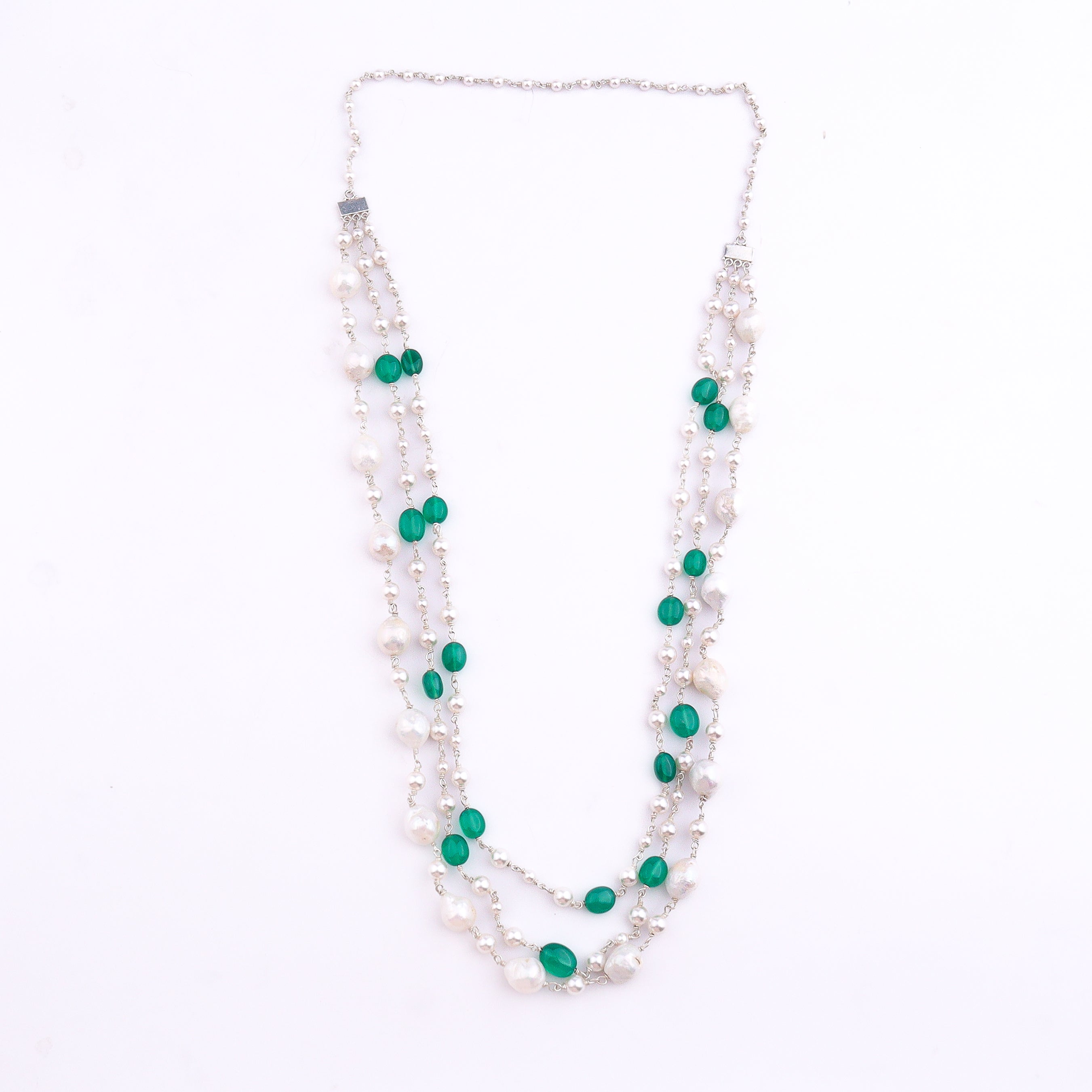 Close-up of freshwater pearl and green onyx necklace