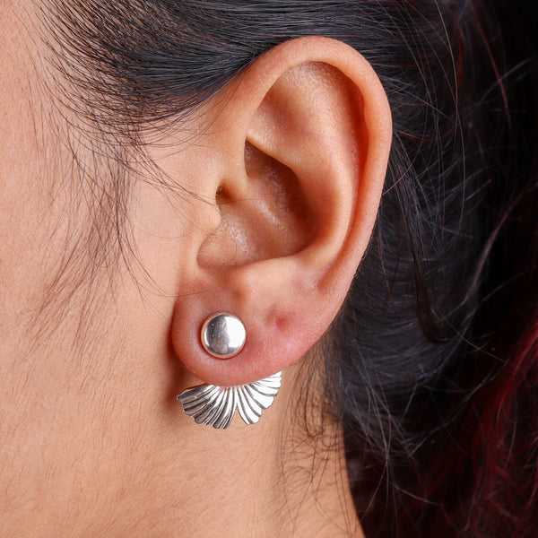 Close-up of silver earrings on white background