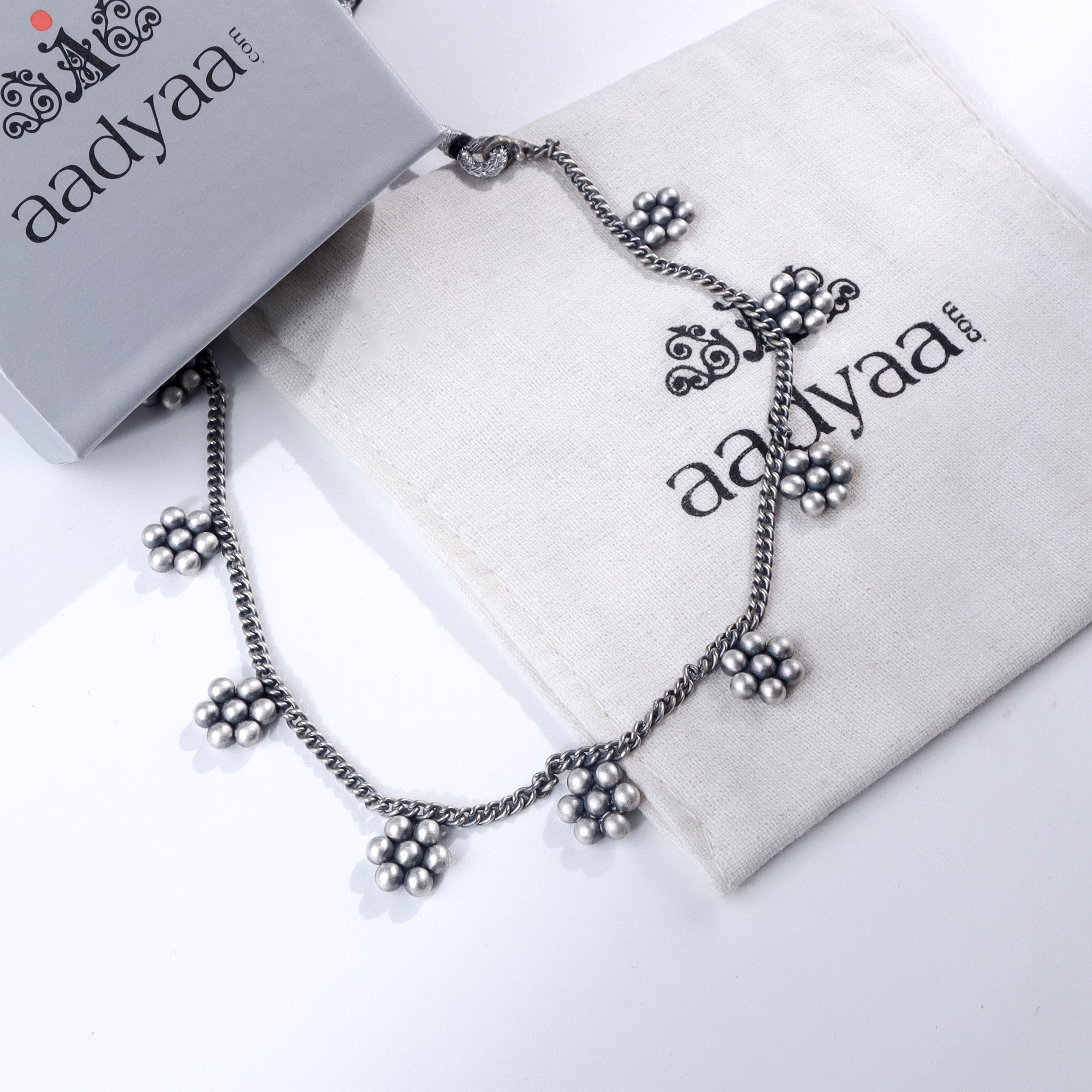 Kudi Chain Choker 9 Motif silver necklace on Aadyaa branded cloth
