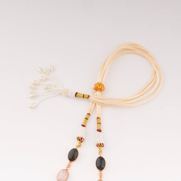 Angled view of a 22K gold-plated fashion set highlighting its coordinated design, elegant structure, and polished gold finish
