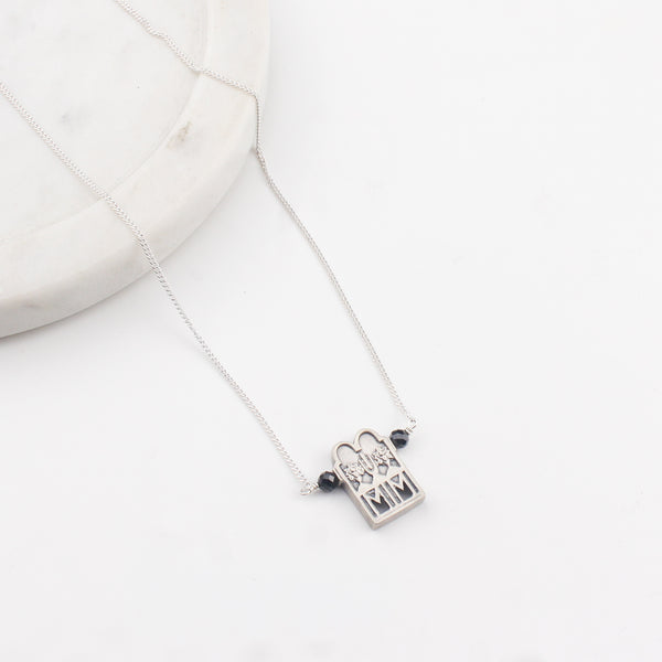 Close-up of silver Taali chain mangalsutra detailing