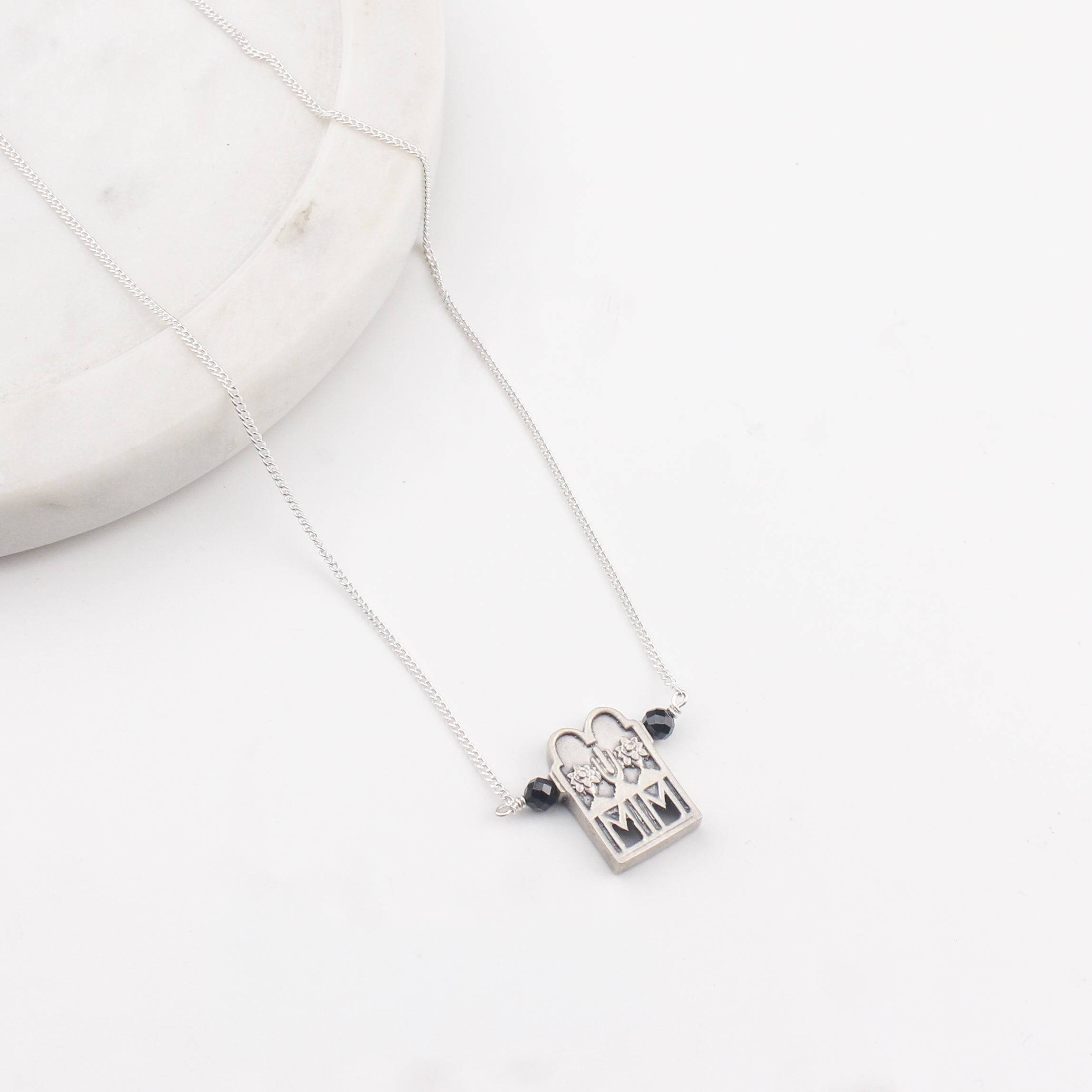 Close-up of silver Taali chain mangalsutra detailing