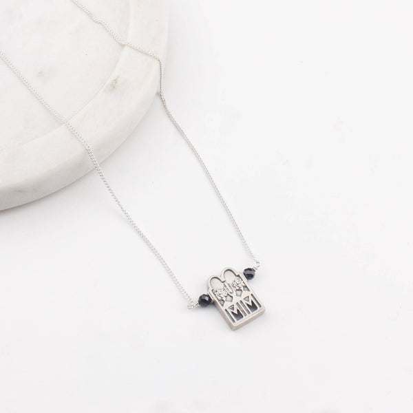 Close-up of silver Taali chain mangalsutra detailing