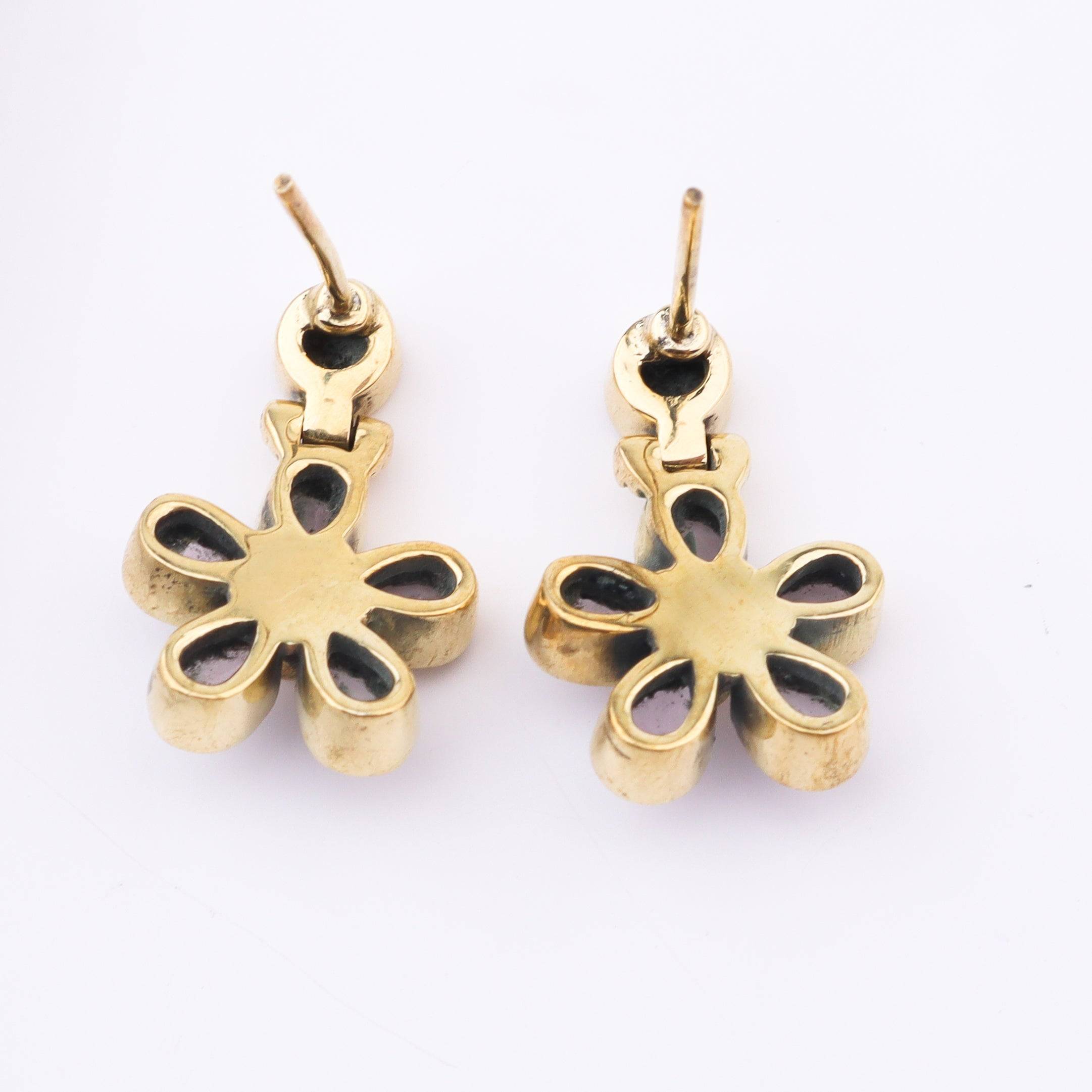 Flat-lay of Brass Fashion Earrings with complementary jewellery and accessories for a chic styling setup