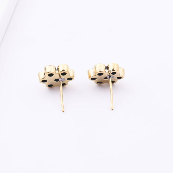Angled view of Brass Fashion Earrings highlighting the unique silhouette, structure, and polished brass finish