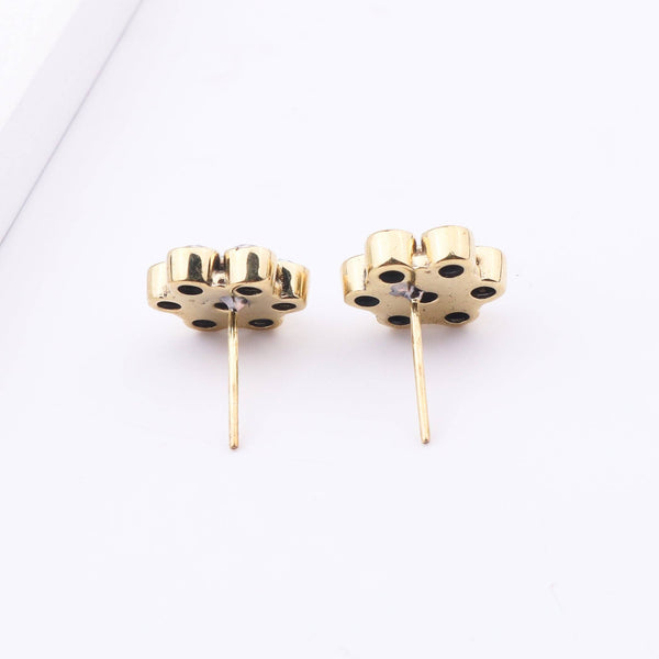 Angled view of Brass Fashion Earrings highlighting the unique silhouette, structure, and polished brass finish