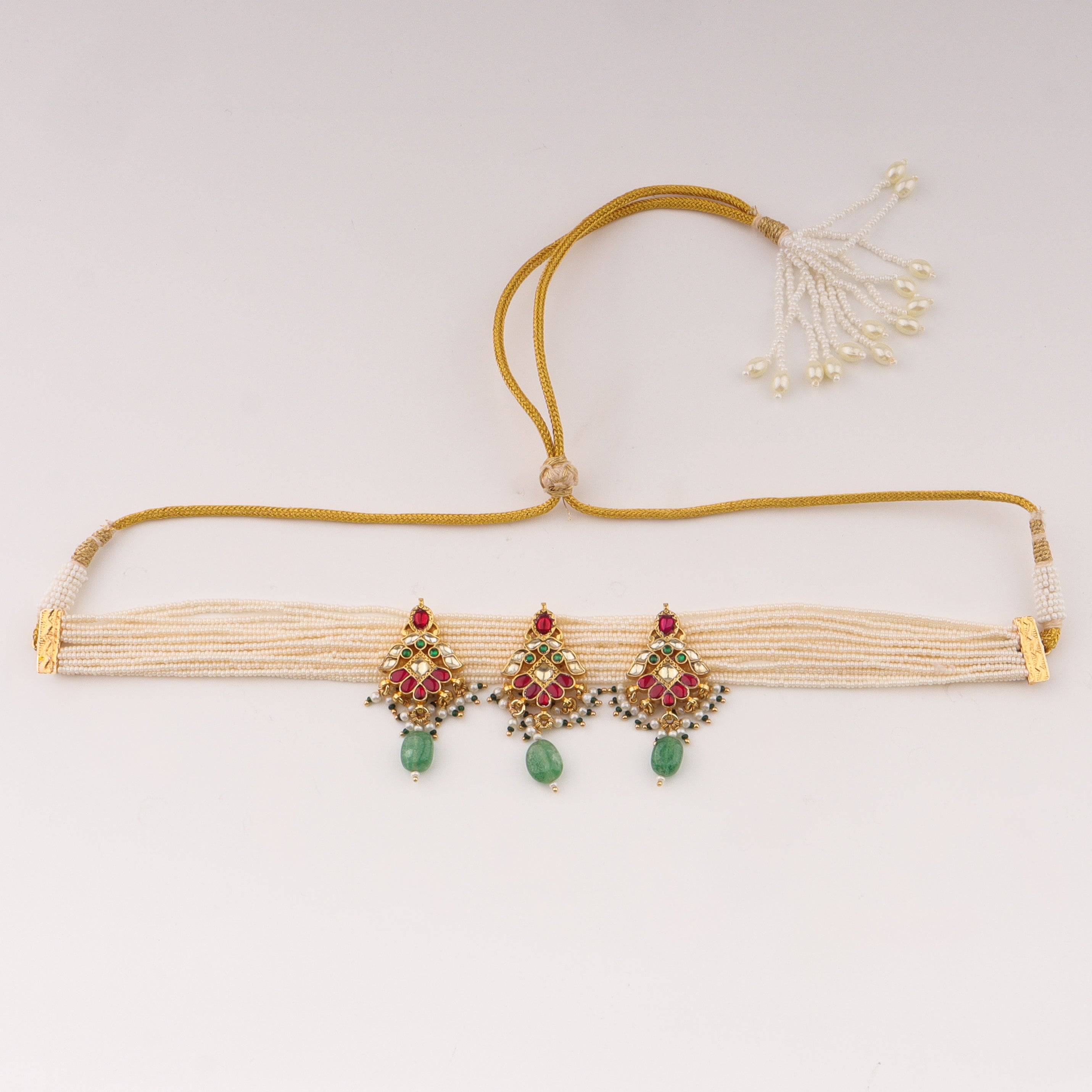 Detailed view of 22K gold-plated fashion necklace highlighting intricate motifs, textured detailing, and a premium 22K gold-plated finish