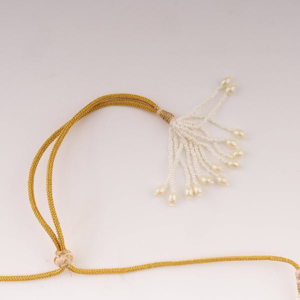 Angled view of a 22K gold-plated fashion necklace highlighting its elegant structure, design, and polished gold finish