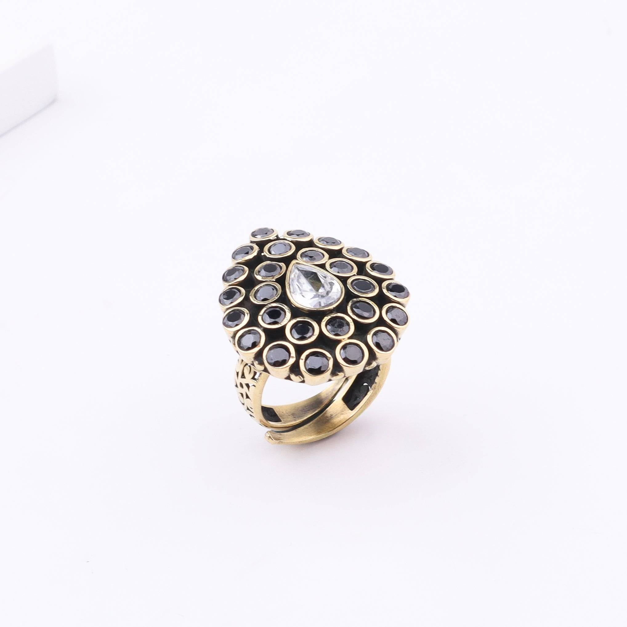 Detailed view of Brass Fashion Ring highlighting intricate motifs, textured surface, and refined brass finish