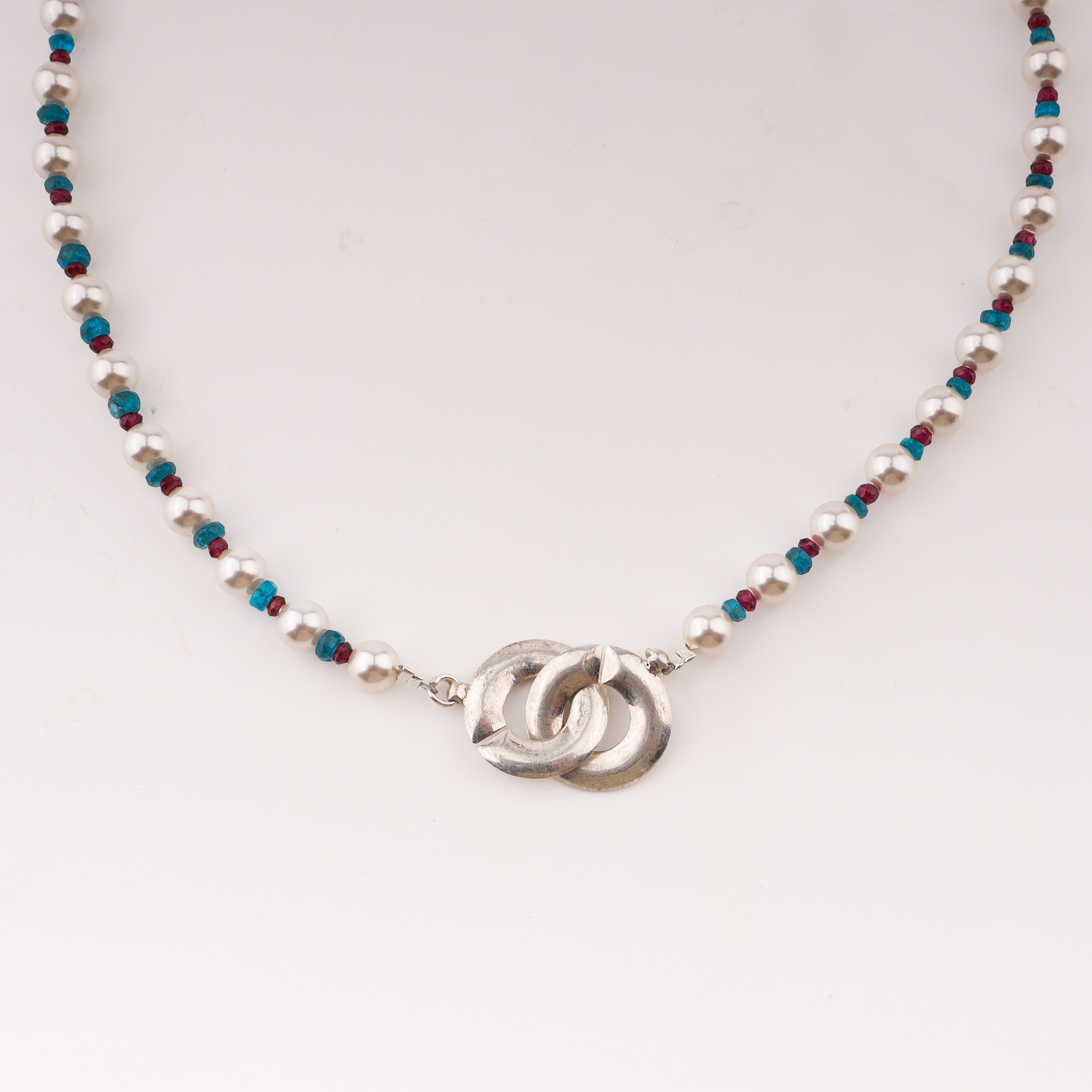 Infinity lock necklace with pearls and semipricious stones