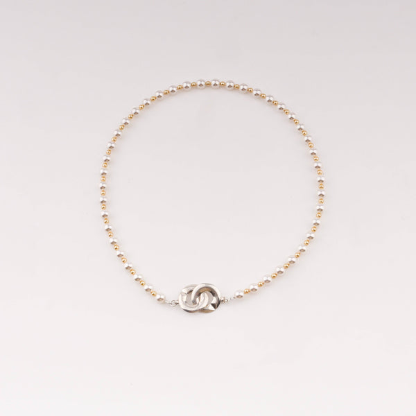 Infinity lock necklace with white and gold pearls in silver