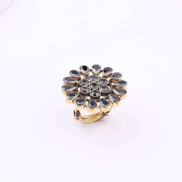 Close-up of a brass fashion ring showcasing intricate detailing, unique design, and fine craftsmanship