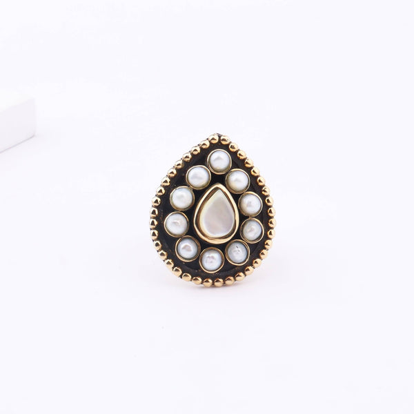 Detailed view of Brass Fashion Ring highlighting intricate motifs, textured surface, and refined brass finish
