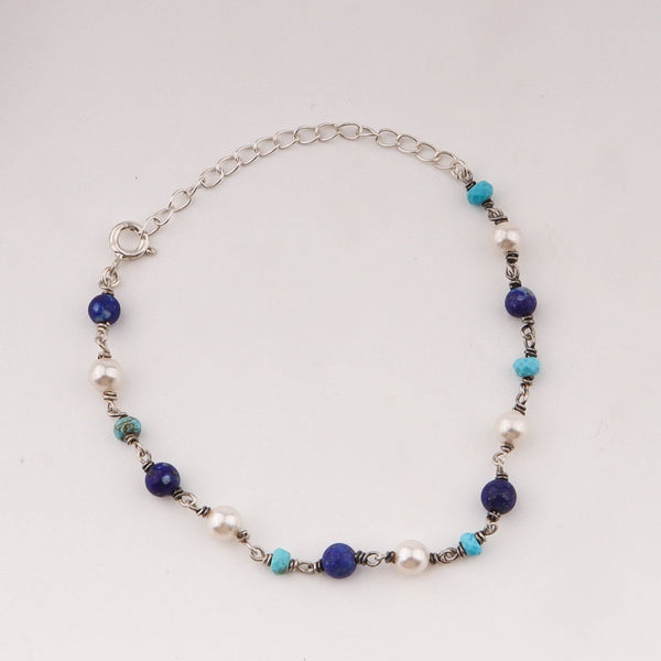 Silver chain bracelet with blue lapis lazuli, turquoise, and white pearls