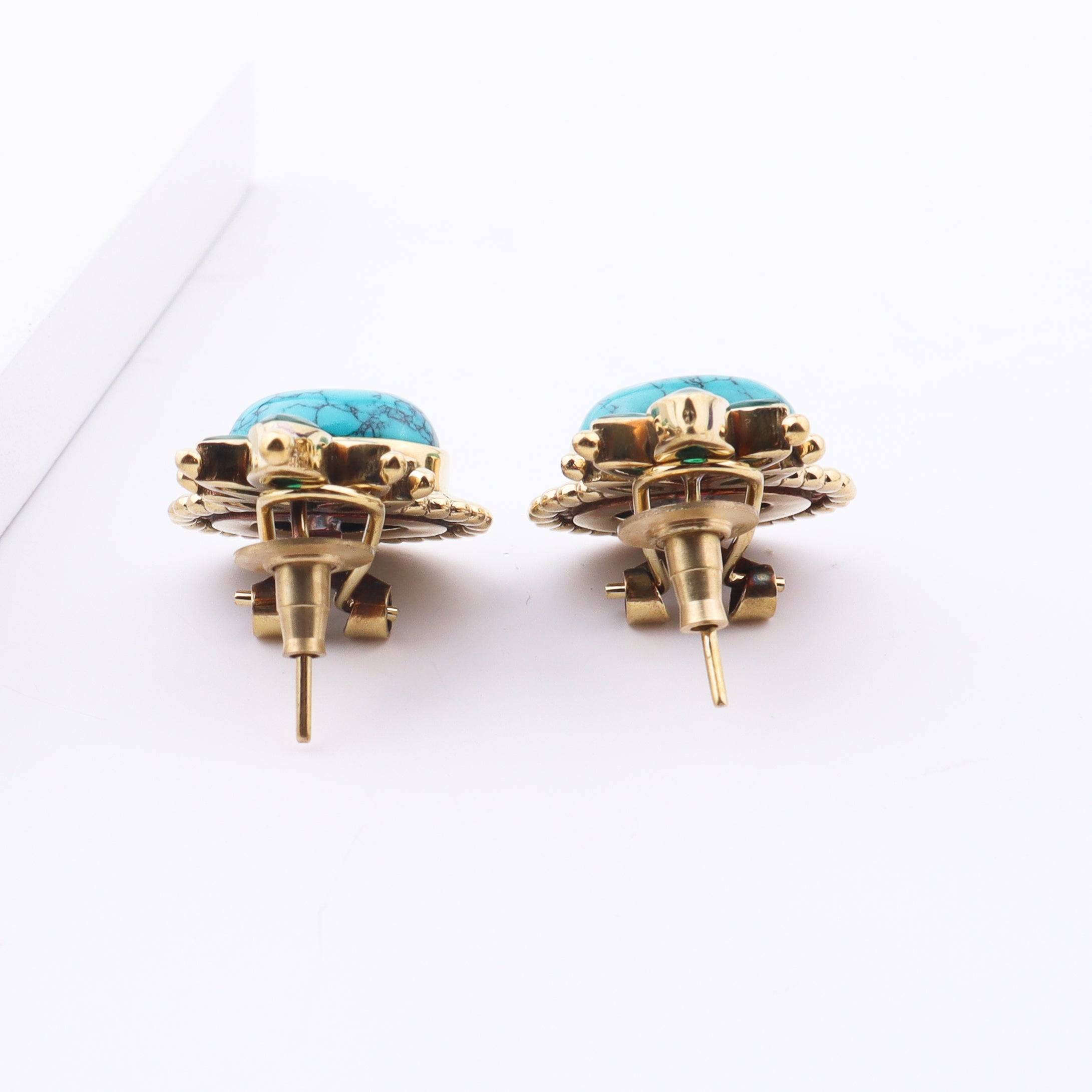 Angled view of Brass Fashion Earrings highlighting the unique silhouette, structure, and polished brass finish