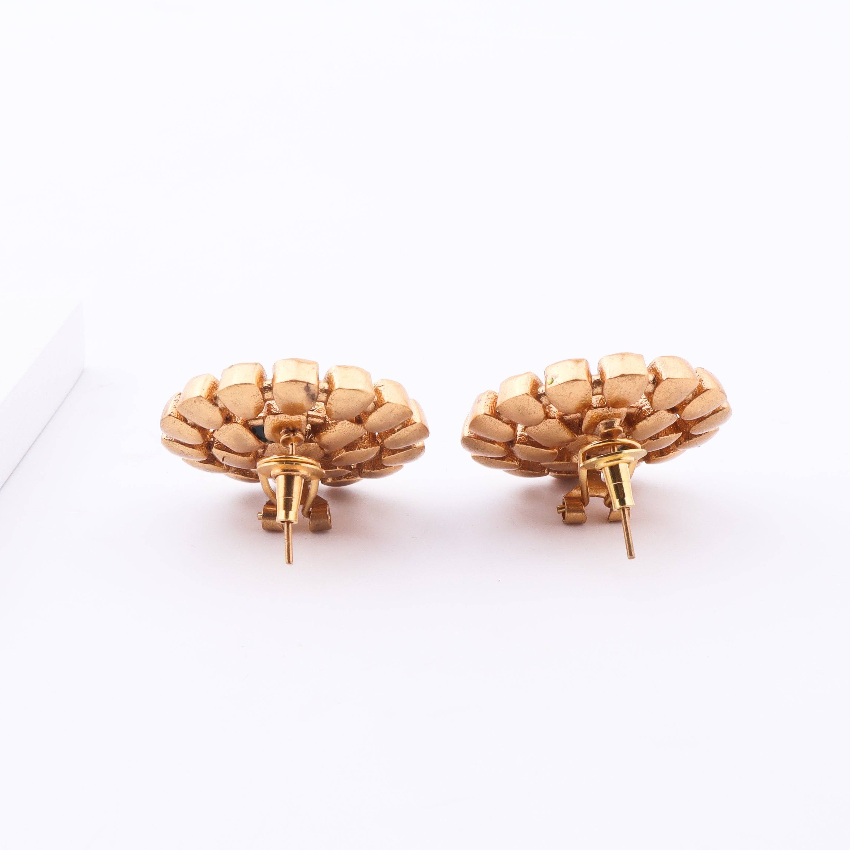 Angled view of Brass Fashion Earrings highlighting the unique silhouette, structure, and polished brass finish