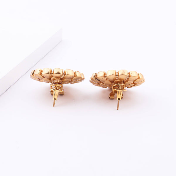 Angled view of Brass Fashion Earrings highlighting the unique silhouette, structure, and polished brass finish