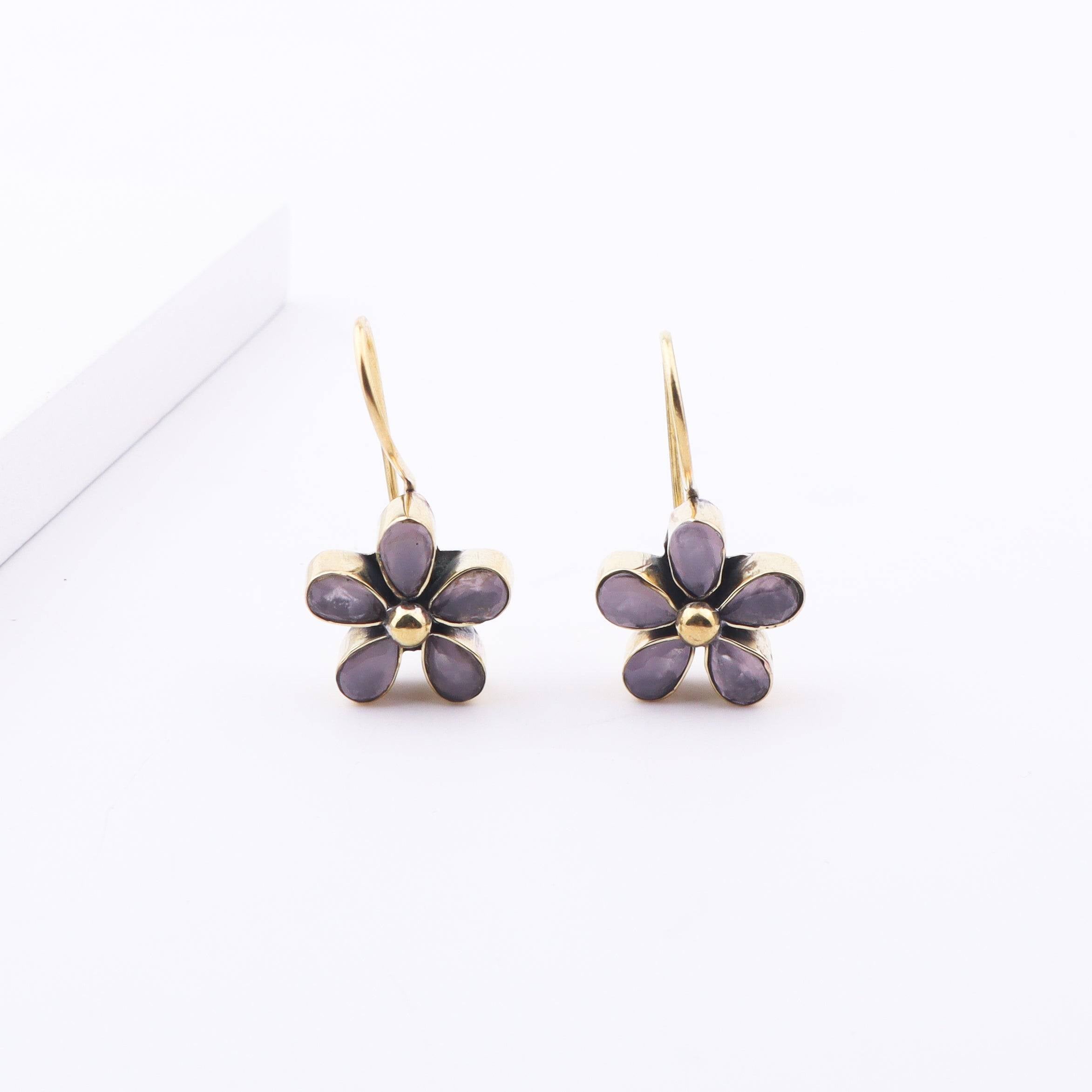 Angled view of Brass Fashion Earrings highlighting the unique silhouette, structure, and polished brass finish