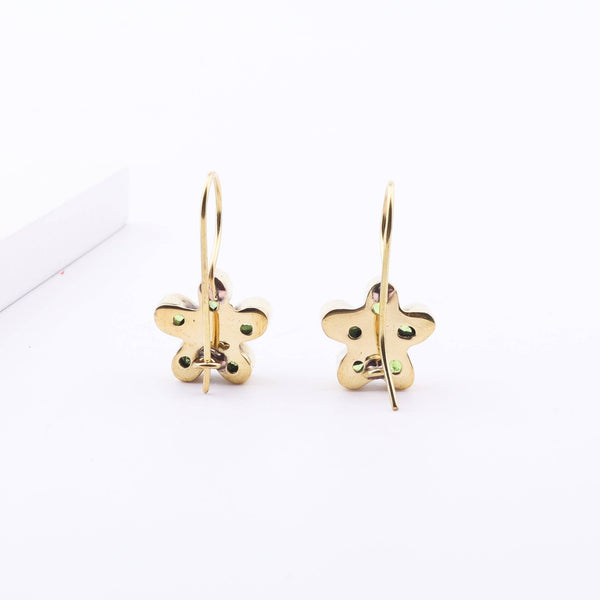 Angled view of Brass Fashion Earrings highlighting the unique silhouette, structure, and polished brass finish