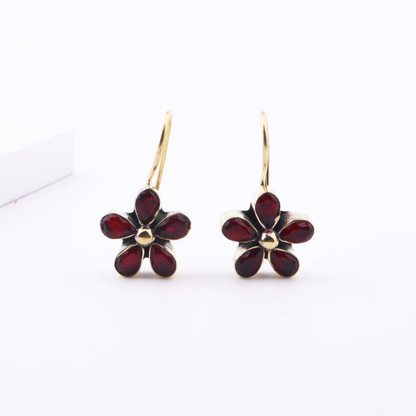 Detailed view of Brass Fashion Earrings highlighting intricate motifs, textured surface, and refined brass finish