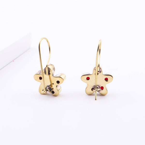 Angled view of Brass Fashion Earrings highlighting the unique silhouette, structure, and polished brass finish