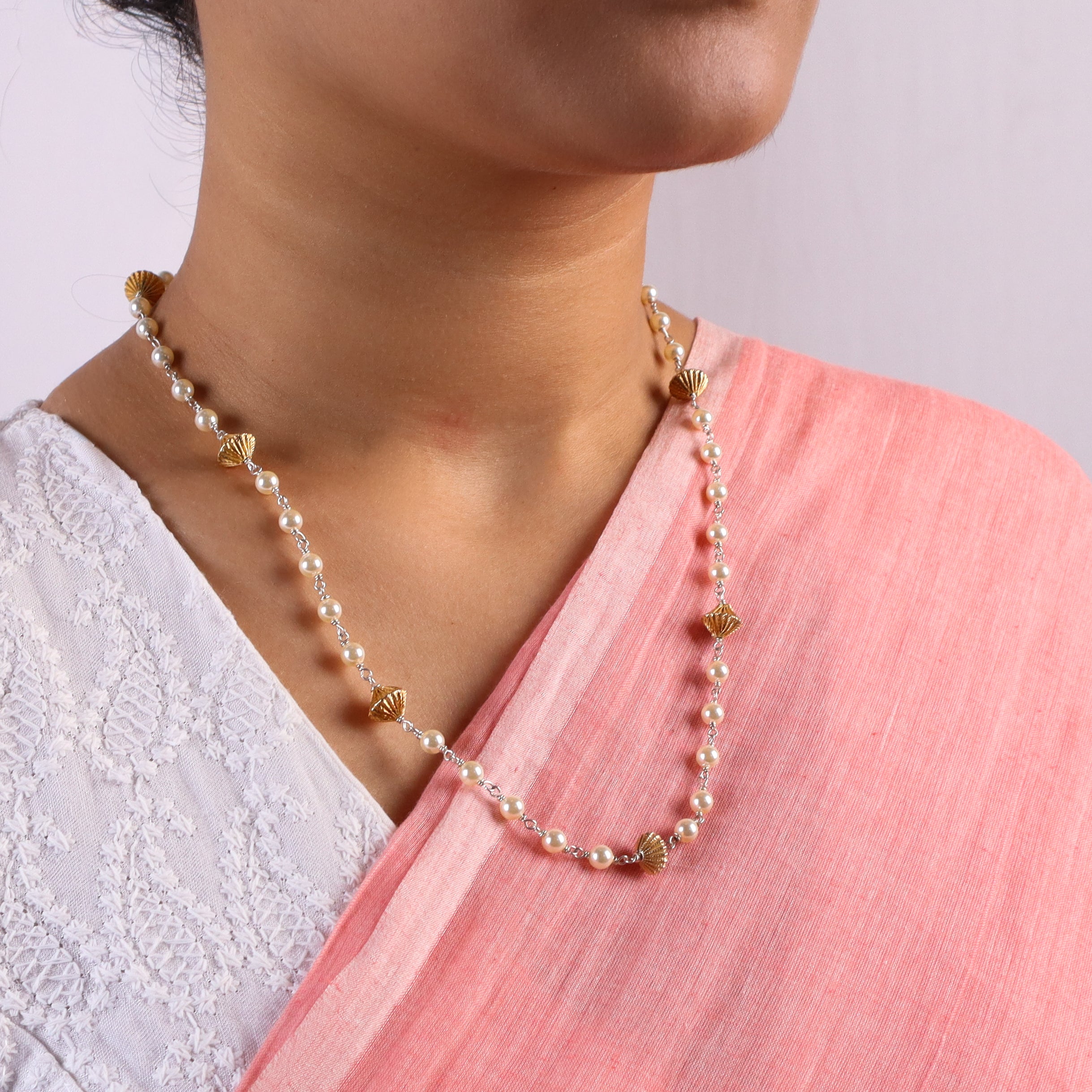 silver bead detailing and pearl accents on ganthan