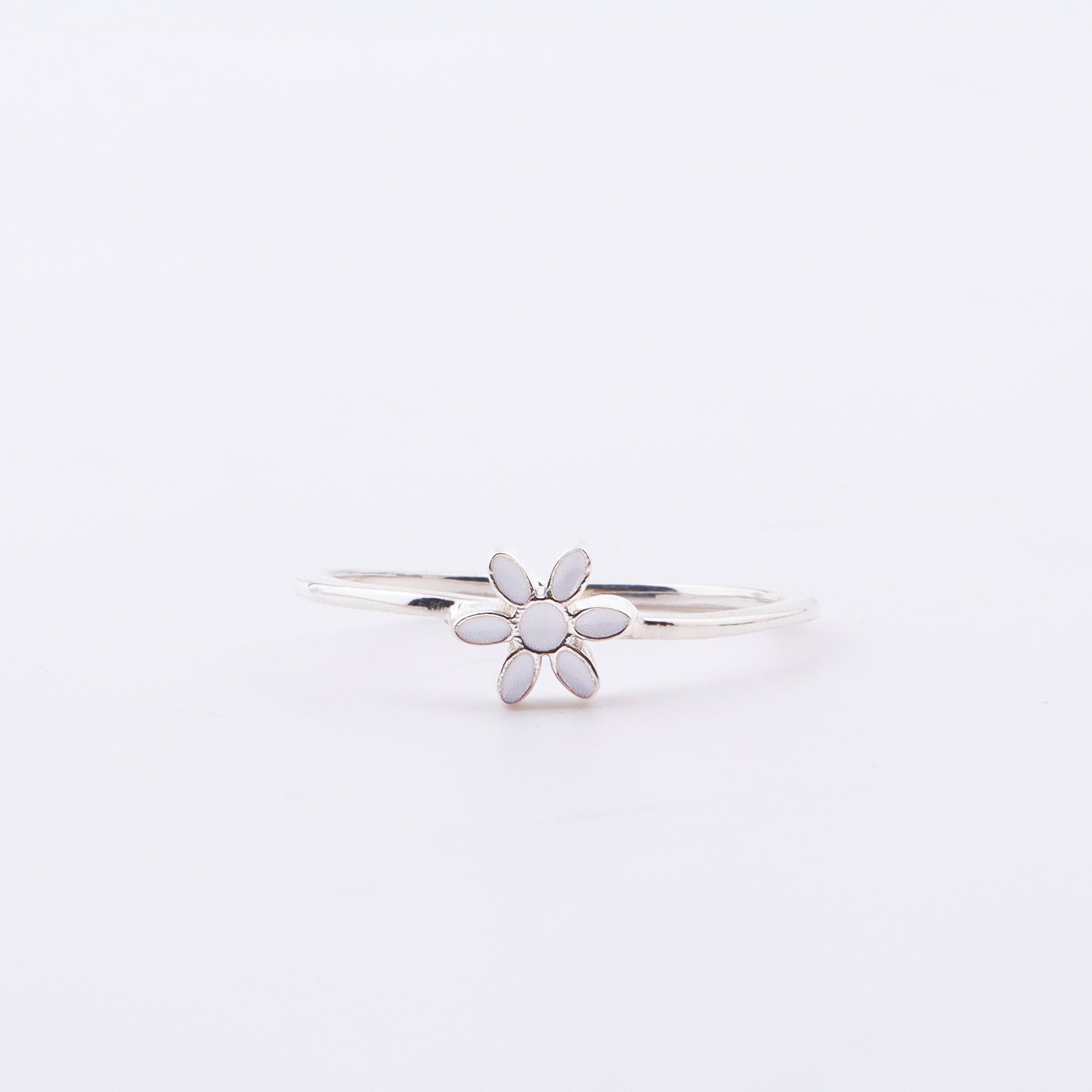 Back view of silver flower enamel ring with 925 stamp