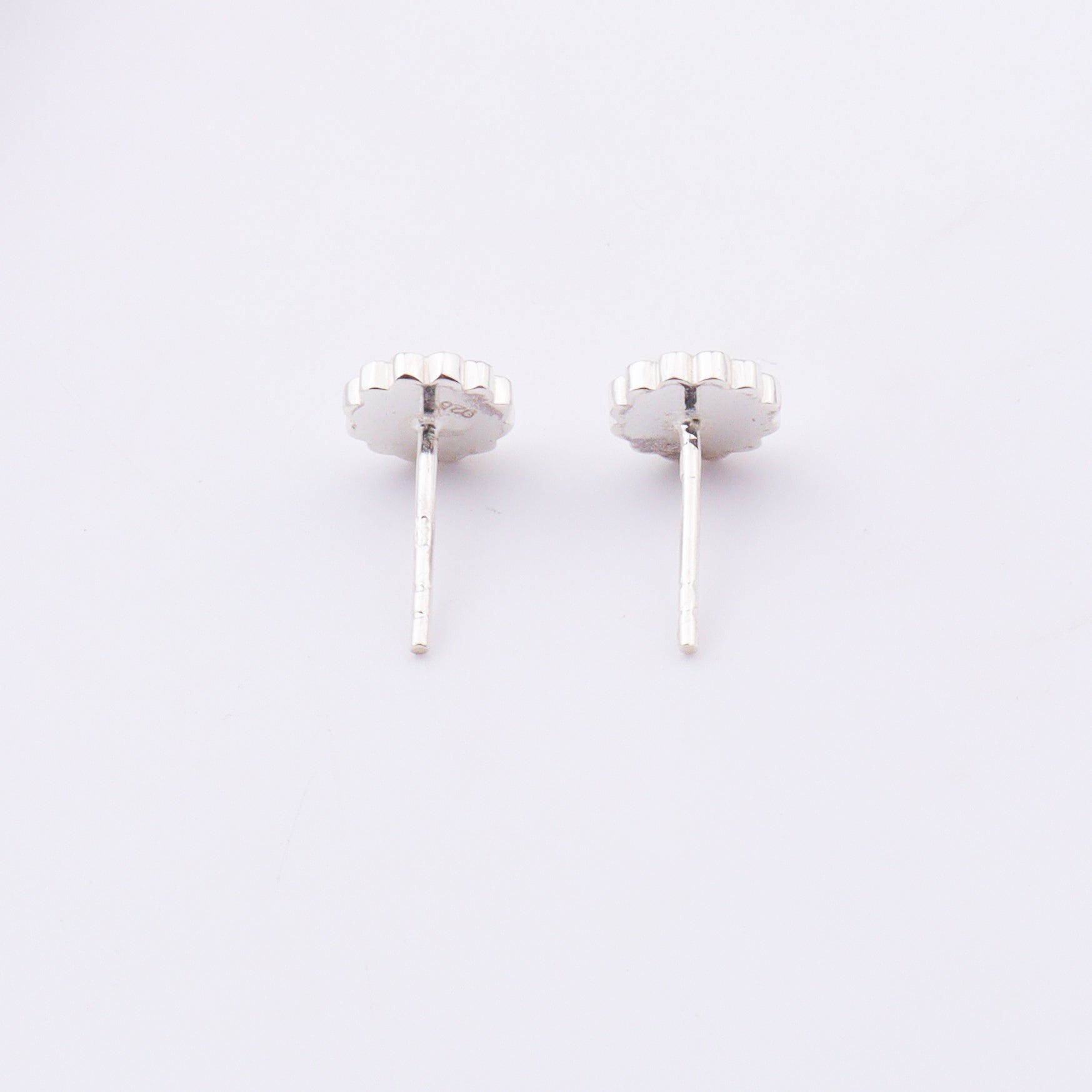 Back view of daisy enamel sterling silver stud earrings