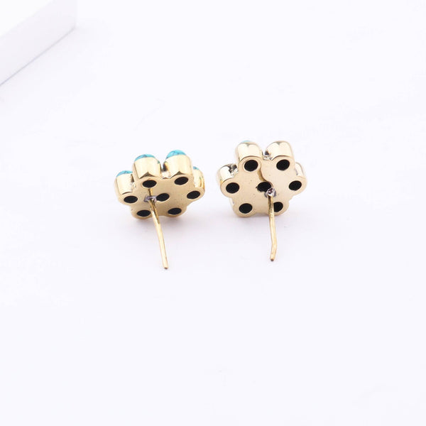 Flat-lay of Brass Fashion Earrings with complementary accessories for a chic jewellery styling setup
