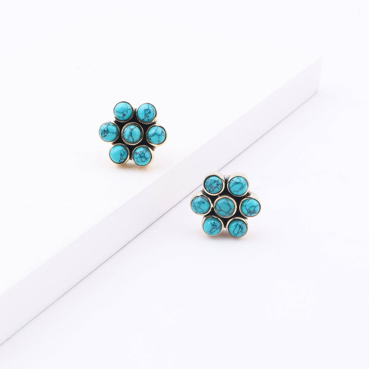 Angled view of Brass Fashion Earrings showcasing the stylish silhouette and dimensional design
