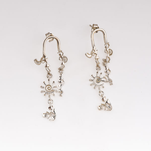Silver earrings with Warli motifs and artisanal design