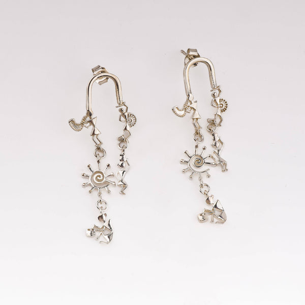 Silver earrings with Warli motifs and artisanal design