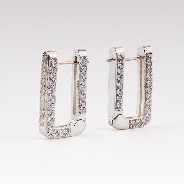 Silver CZ stone hoop earrings on white background