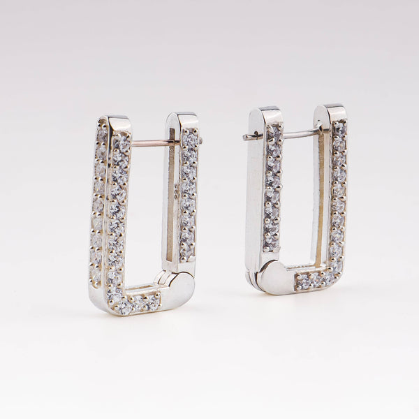 Silver CZ stone hoop earrings on white background