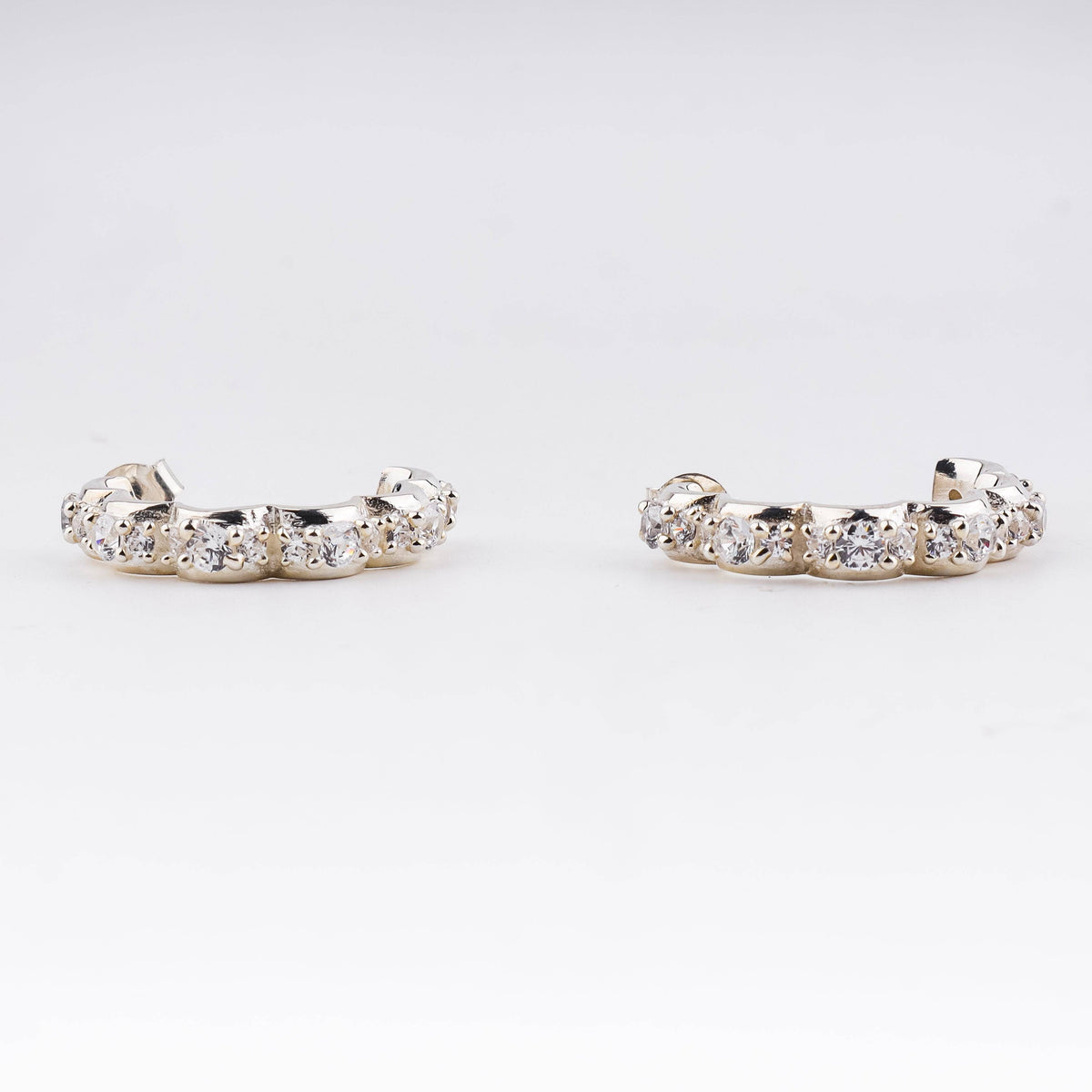 Silver floral hoop earrings with CZ stones